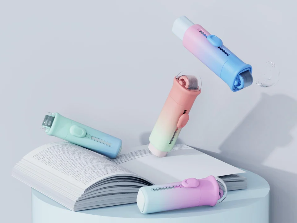 Pastel Rollie erasers arranged above and on an open notebook