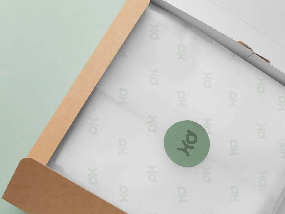 Inside of the kraft packaging showing a printed sheet and green circular mark