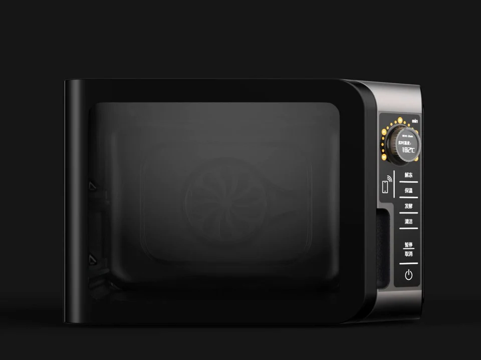 Black countertop steam oven with a dark glass door and right-side controls