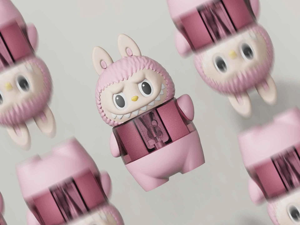 Repeated pink MomoSharp character sharpeners showing their clear shavings compartments