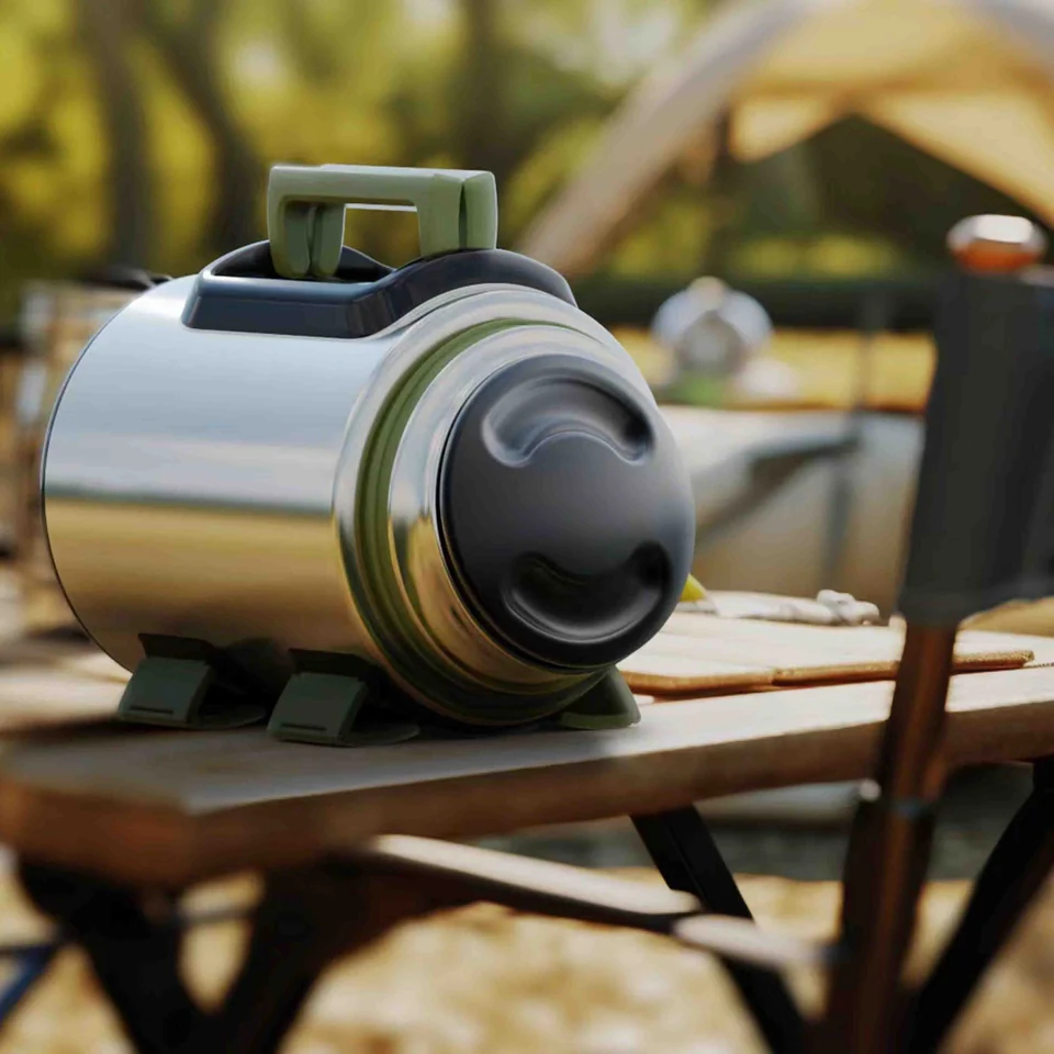 Large TerraJug outdoor flask lying on a camp table with its handled lid in the foreground