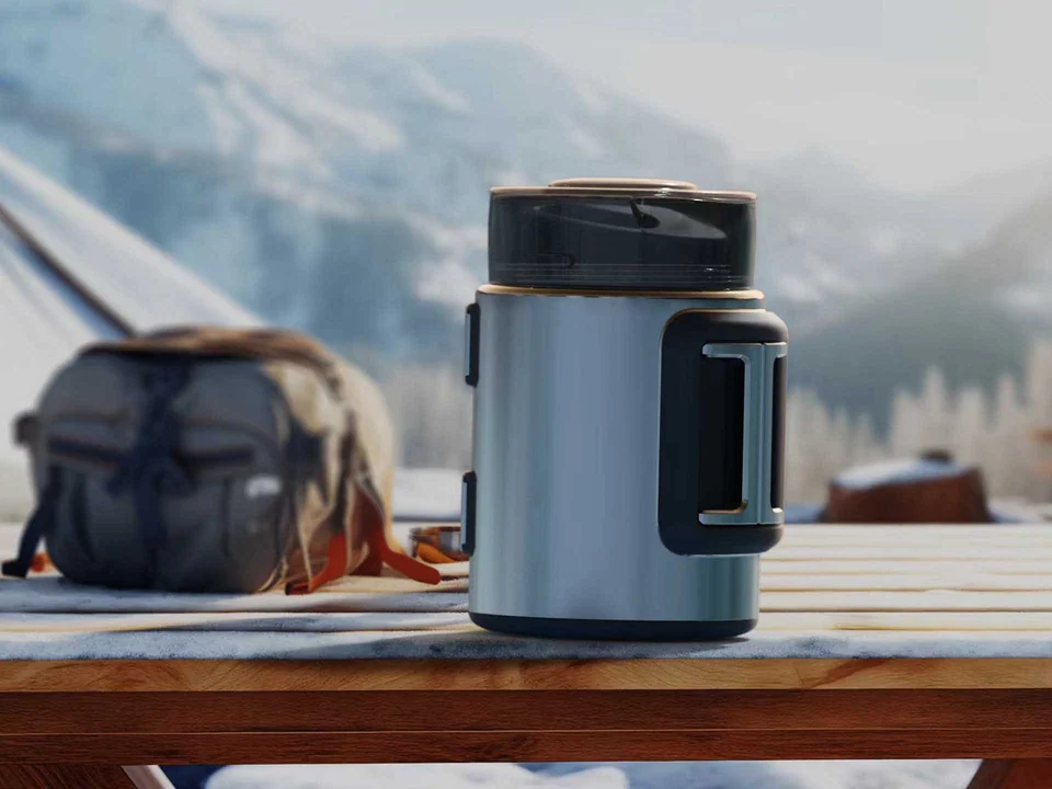 Blue-grey TerraJug flask standing on a wooden table against a mountain landscape