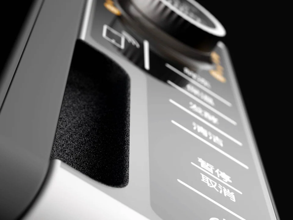 Close-up of the steam oven dial, textured handle and control labels