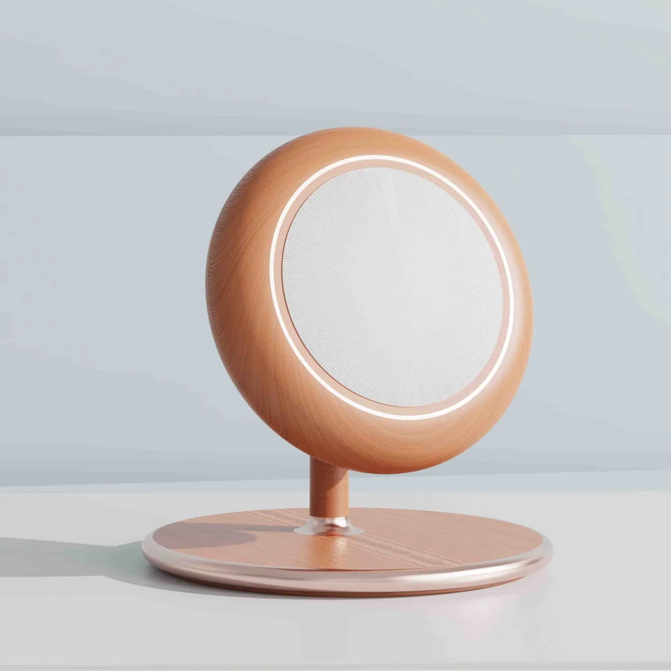 Peach-coloured round tabletop mirror on a matching circular base